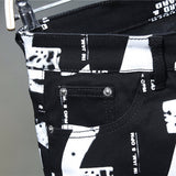 Men&#39;s White Letters Numbers Print Black Jeans Trendy Sim Fit Stretch Denim Pencil Pants Trousers